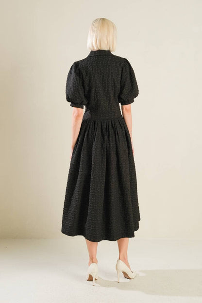 A textured woven midi dress - Black / Contemporary