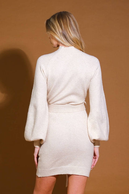 A sweater knit midi dress: CREAM / Contemporary